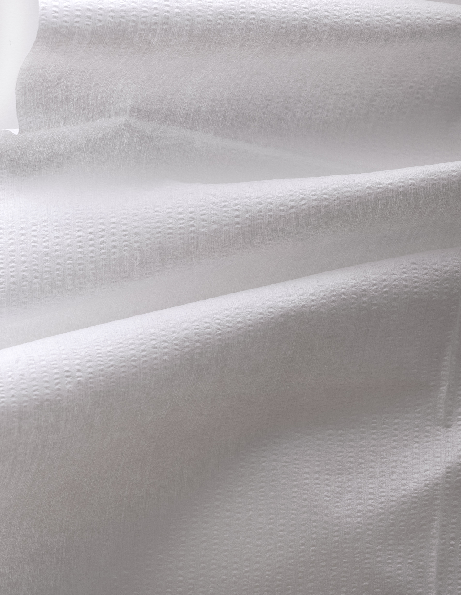 Kräppad draperad torkduk.